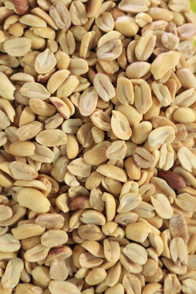 Pile of shelled peanuts close up.