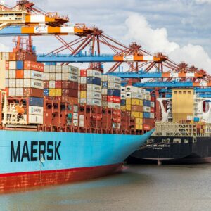 blue and red cargo ship on dock during daytime