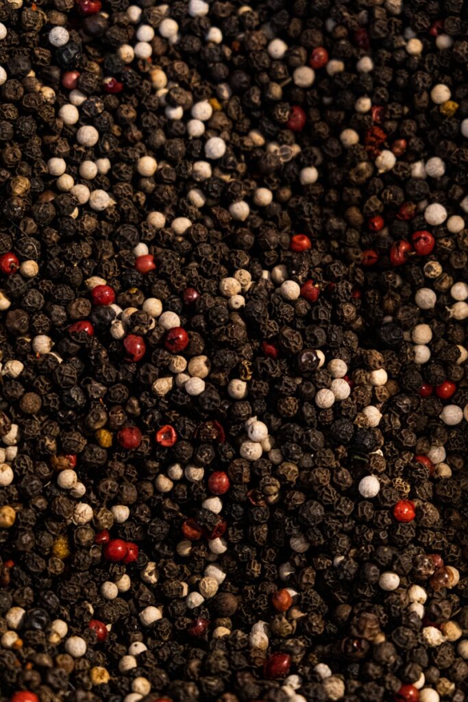 a close up of a pile of red and white pebbles